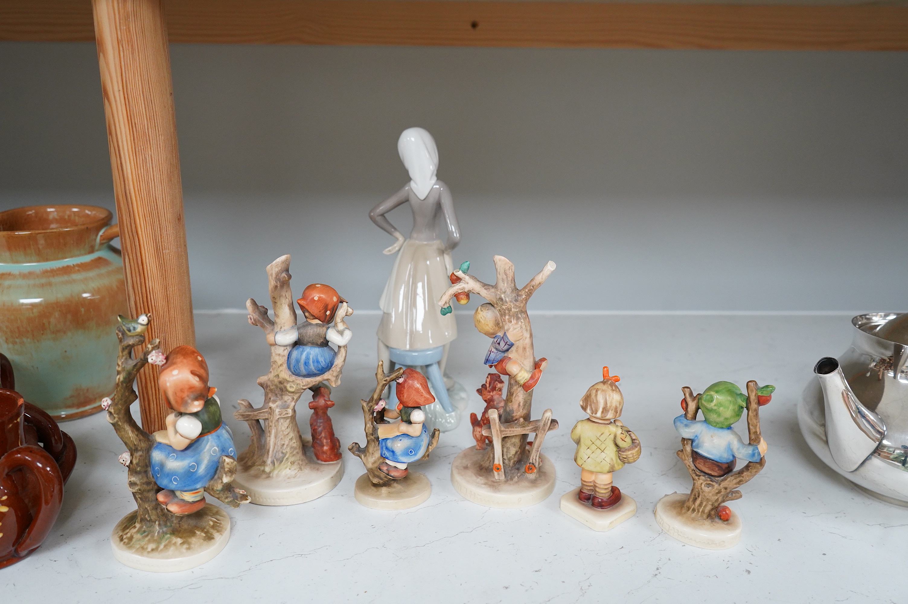 Six various Goebel figures and a Lladro figure, 24cm high